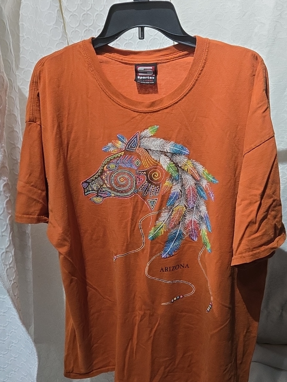 Vintage Sportex Orange Short-Sleeve Graphic Tee with Feather Horse Design